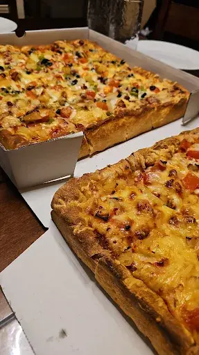 Chicago-style deep dish pizza at Chicago Deep Dish Pizza Edgemont, Calgary