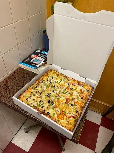 Freshly baked deep dish pizza at Chicago Deep Dish Pizza Calgary